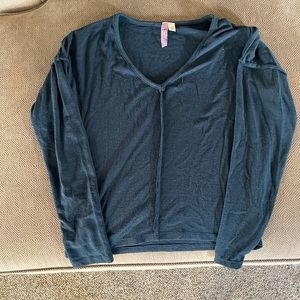 Lightweight slate blue sweater with outward seam